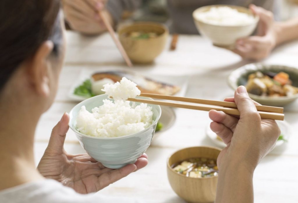 people eating rice with chopsticks people eating rice with chopsticks