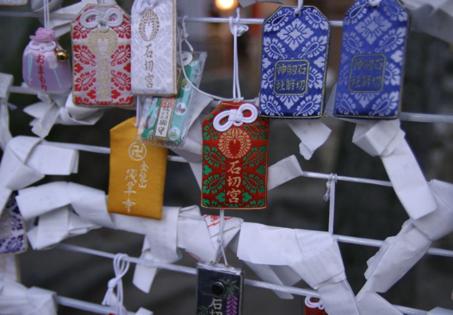 omamoris hanging in a Japanese temple