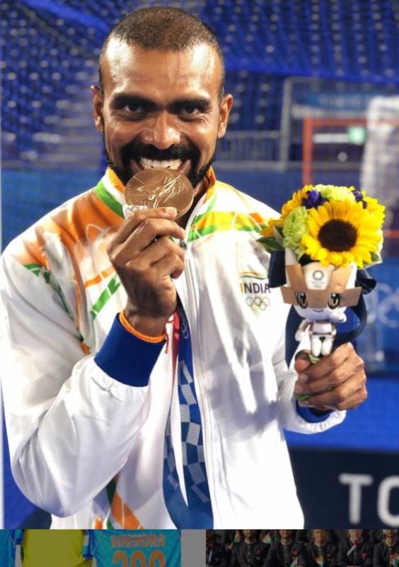 PR Sreejesh mordiendo su medalla de bronce en los Juegos Ol&iacute;mpicos de Tokio 2020