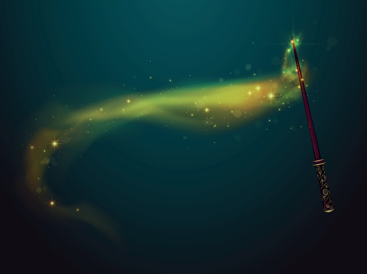 Una varita m&aacute;gica de aspecto encantador con un brillo verde a su alrededor como si estuviera lanzando magia.