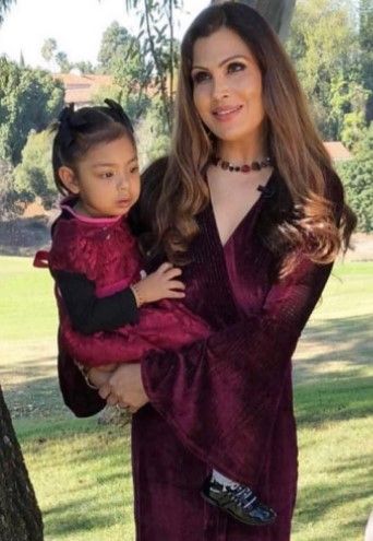 Kimi con su hija Cyrah