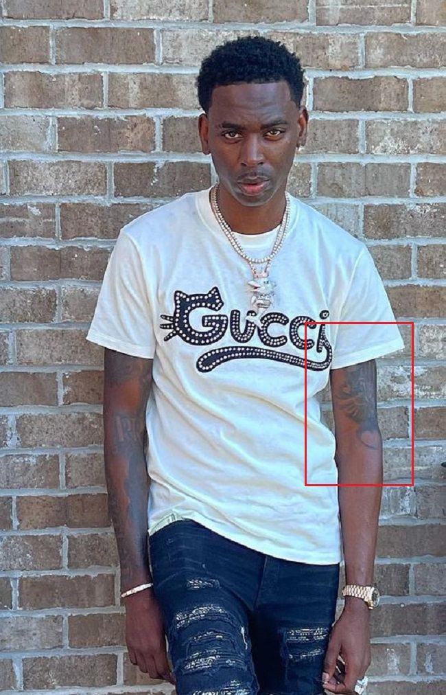 Tatuaje de Young Dolph en el brazo izquierdo