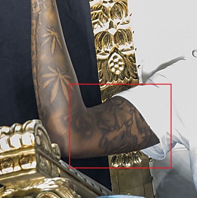 Tatuaje de Young Dolph en el brazo derecho